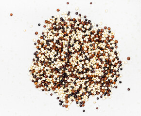 pile of blend of quinoa grains close up on gray