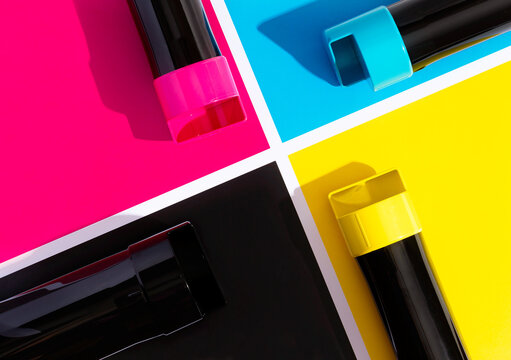 A set of toner cartridges for a color laser printer. Equipment for printing on the background of SMYK. bright creative concept minimal