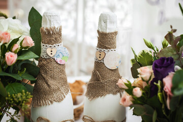 decorated champagne bottles and flowers. wedding theme