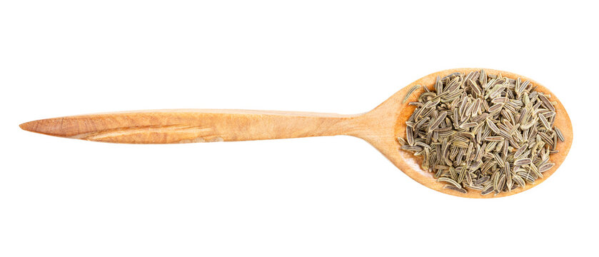 top view of wood spoon with kala zeera seeds