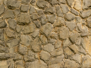 Background. Stone wall. Ancient masonry.