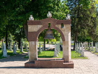 Naklejka premium A large bell in a Christian cemetery.