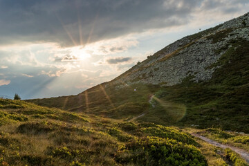 landscape with mountains and clouds at sundown