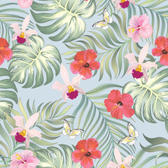 Tropical vector summer pattern. Jungle print with hibiscus flowers and palm leaves.
