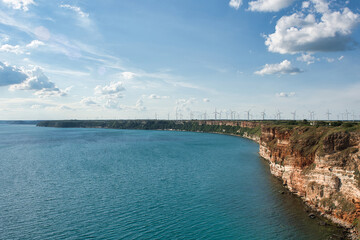 Obraz premium Wind turbines on coastline suggesting increased development of renewable energy