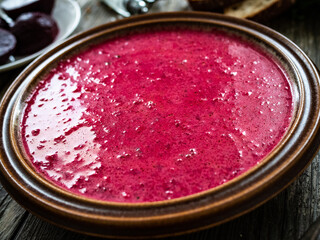 Beetroots soup on wooden table
