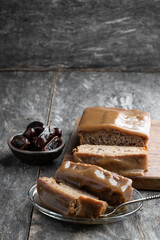 Sticky toffee pudding butter sponge with dates on wooden table