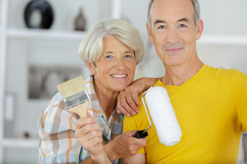 senior woman and man with brushes