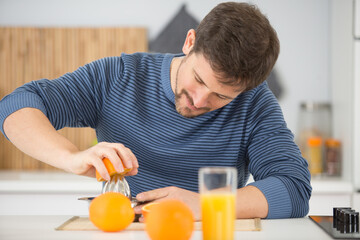 happy man drinking orange juice