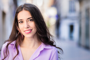 Obraz premium beautiful hispanic independent young woman lifestyle urban portrait. Lavender streetwear stylish looking at camera. Real people