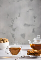 hot black tea with sugar and cookies