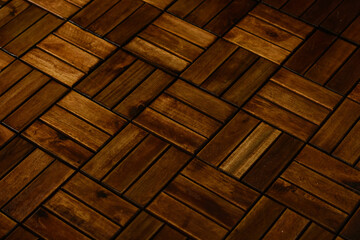 Wooden parquet, texture. The floor is made of dark wood planks. Floor covering.