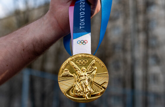 Hand Holding Up A Gold Medal Stock Photo 63033997 - Megapixl