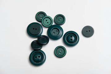 old plastic buttons in different colors on the background.