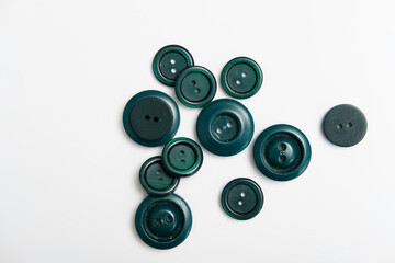 old plastic buttons in different colors on the background.