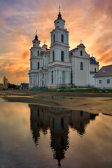 Catholic church in Budslau (Belarus) in the evening, against the backdrop of a beautiful sunset