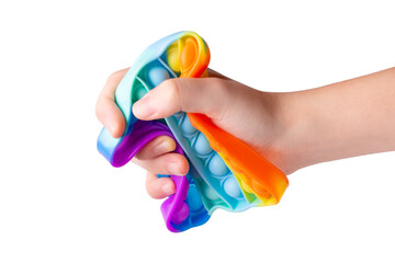 Child brush squeezes a pop up toy. Silicone toy antistress in the hands of a teenager. Anti-stress...