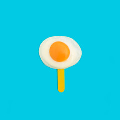 Creative summer food concept with fried egg on ice cream stick