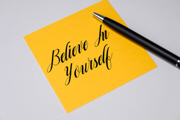 Believe in yourself text written on a sticky notes