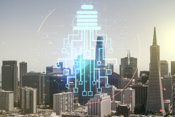 Double exposure of virtual creative light bulb hologram with chip on San Francisco city skyscrapers background, idea and brainstorming concept