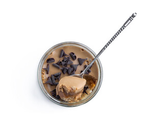 Mini caramel cheesecake in a glass pot isolated on white