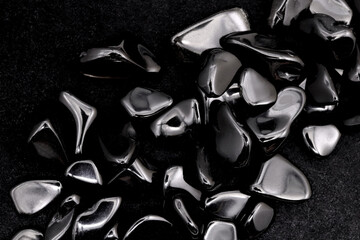 Obsidian heap up jewel stones texture on black background