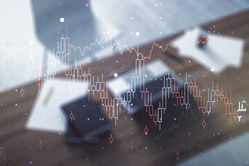 Abstract creative financial graph and modern desktop with pc on background, financial and trading...