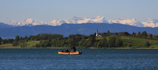 Idyllic landscape in Zurich Canton. Lake Pfaffikon and village Seegraben.