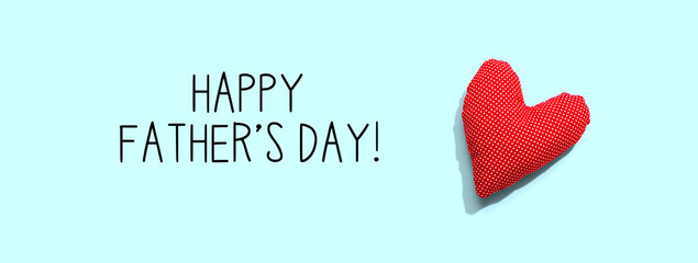 Happy fathers day message with a red heart cushion