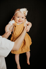 homemade photos of a pretty girl taken in her parents' bedroom when she is playing with mom lying on the bed