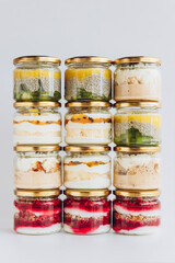 Trendy organic desserts in jars on a solid background. Concept for cafes, restaurants and restaurants with healthy products