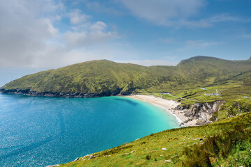 Keem beach, Achill island in county Mayo, Ireland, warm sunny day. Clear blue sky and water of the Atlantic ocean.