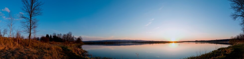 Panorama lake view in sunrise time .Sunrise at the lake