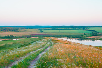 The road through the mountain hills in the evening.