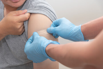 nurse stick Medicinal plasters give man after being vaccinated