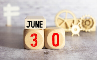 June 30th.June 30 white wooden calendar on vintage wood abstract background. Summer day.