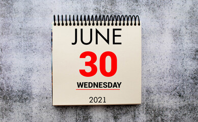 Save the Date written on a calendar - June 30