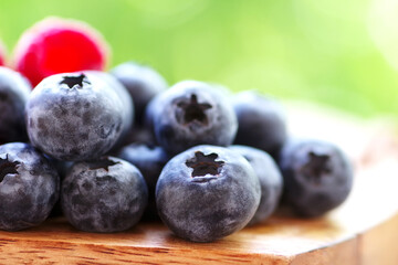 closeup of blueberries on wooden table