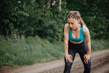 Fit sporty woman take breath at jogging workout