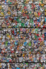 Moscow. Russia. October 2020. Aluminum cans are pressed into cubes. Tightly pressed aluminum beverage cans in a garbage factory after sorting