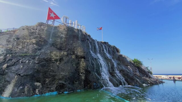 Cuba Waterfall Fountain on EL Malecon, Avenida de Maceo, a broad landmark esplanade that stretches for 8 km along the coast in Havana past major city tourist attractions.