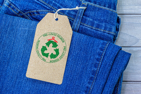 pre loved fashion label on second hand jeans, sustainable fashion