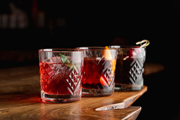 Row of bitter cocktails on a bar counter
