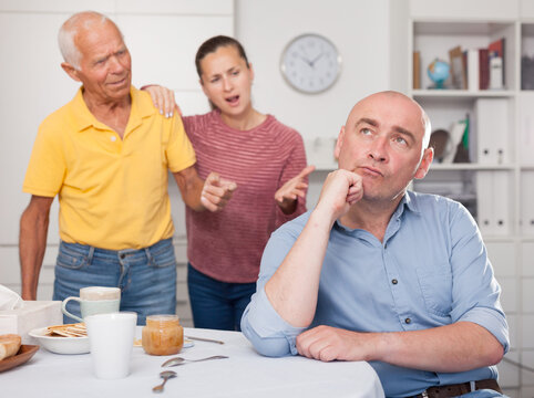 Daughter With His Father Scolded Son In Law At Home. High Quality Photo