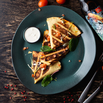 Triangle Tortilla Wraps Top View On A Dark Rustic Pub Table