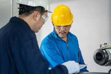 Mechanical technician industrial worker team work on milling machine