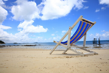 Close up beach chair with blue sky on sunny day , summer vacation and travel concept