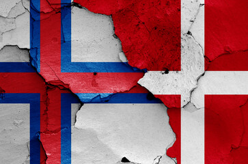 flags of Faroe Islands and Denmark painted on cracked wall