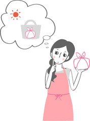 お弁当を持って気温を心配するエプロン姿の女性。