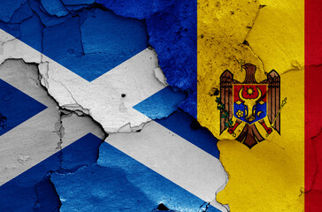 flags of Scotland and Moldova painted on cracked wall